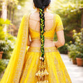 Suwasna Green & Yellow Braided Parandi with Floral Motif & Golden Jhumka Tassels | Bridal Hair Accessory_1