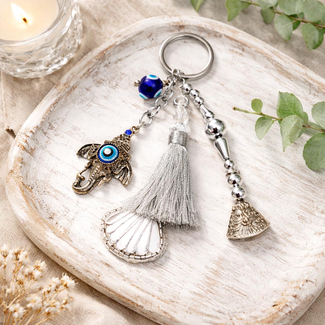 Suwasna Metal Evil Eye Ganpati Ji Trunk Bag Charm & Keychain with Mirror Tassel | Boho Ethnic Accessory India